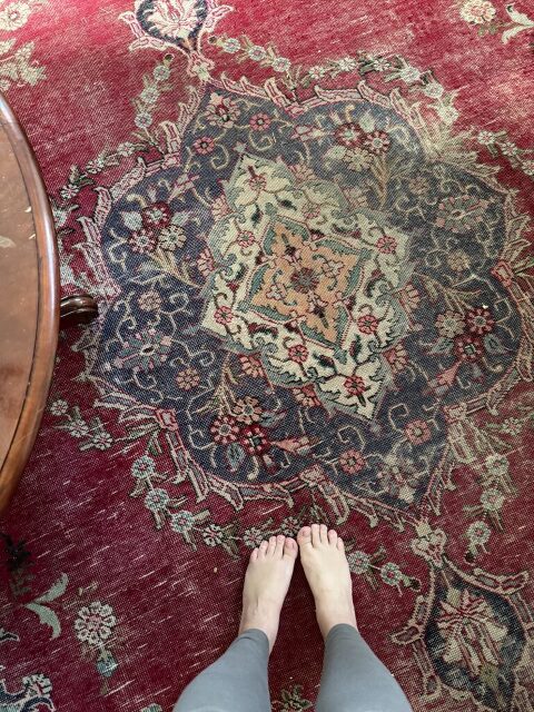 bare feet on Persian rug