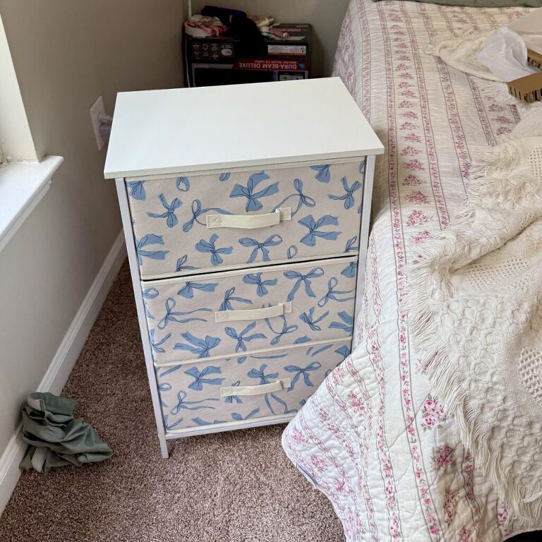 White nightstand from Aldi with blue bows on drawers
