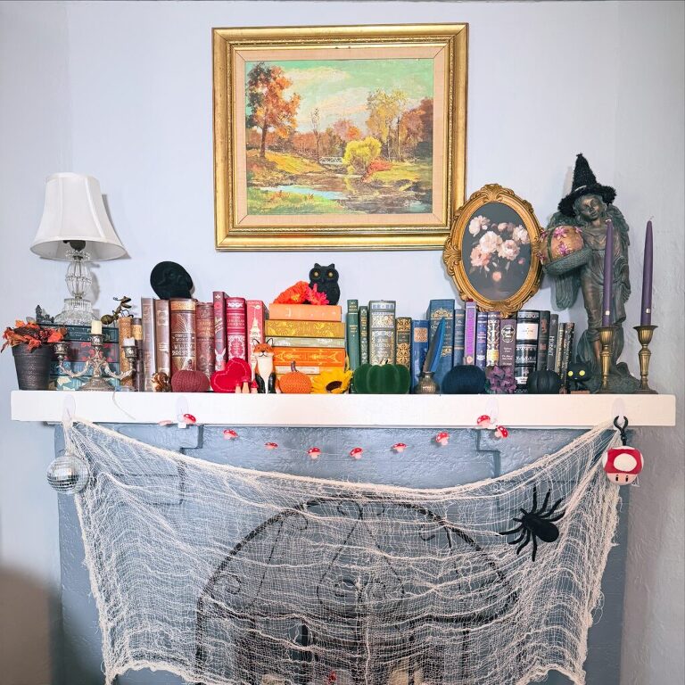 Fall fireplace mantel decorated with books