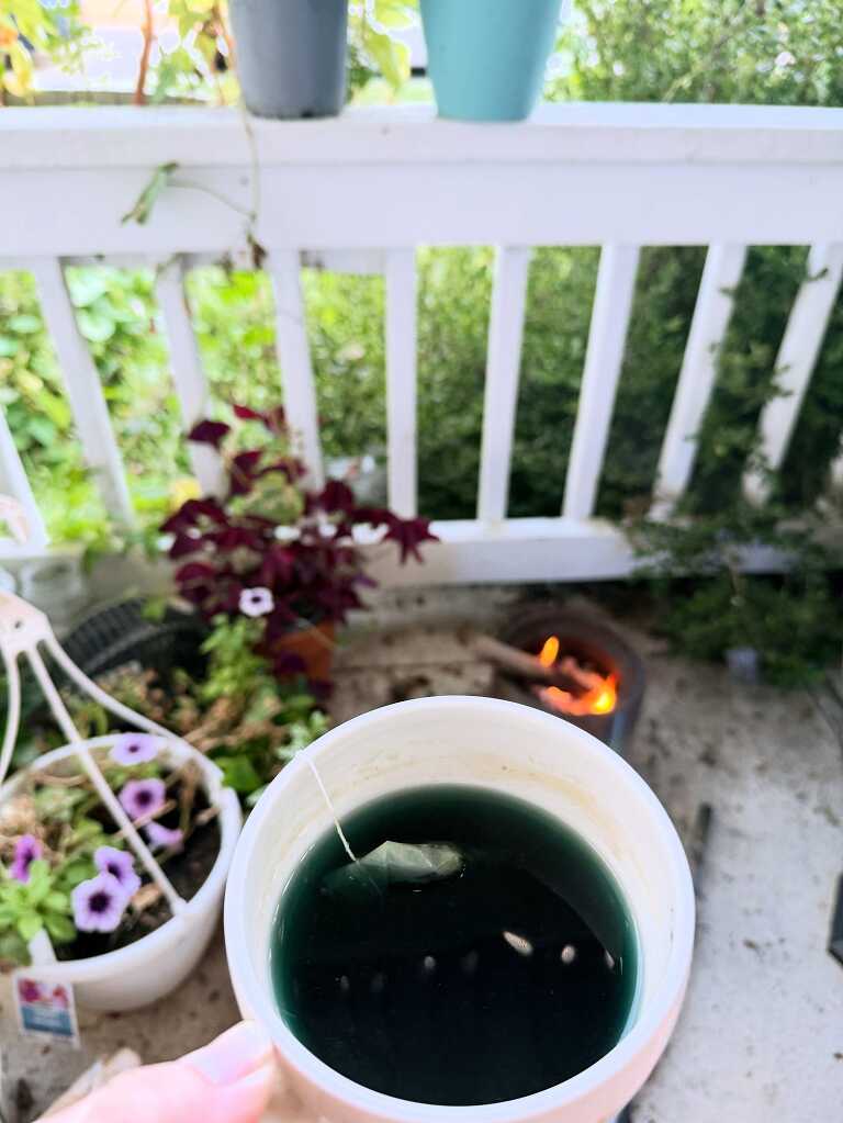 cup of tea and small fire on the porch